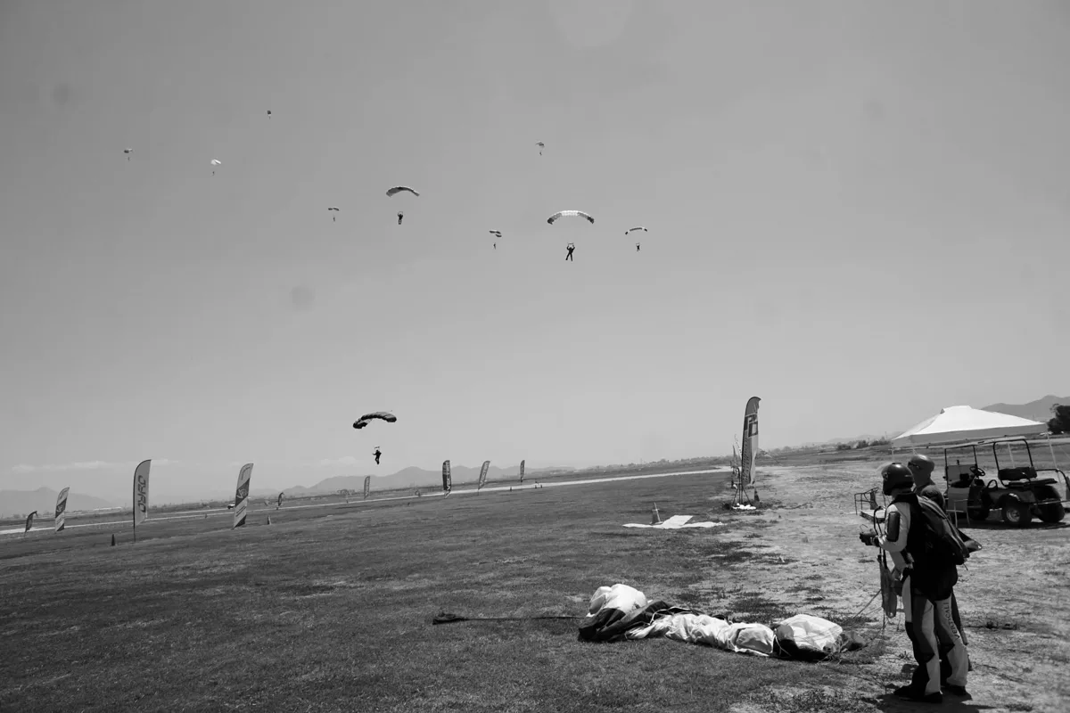 Skydivers and parachutes back on the ground